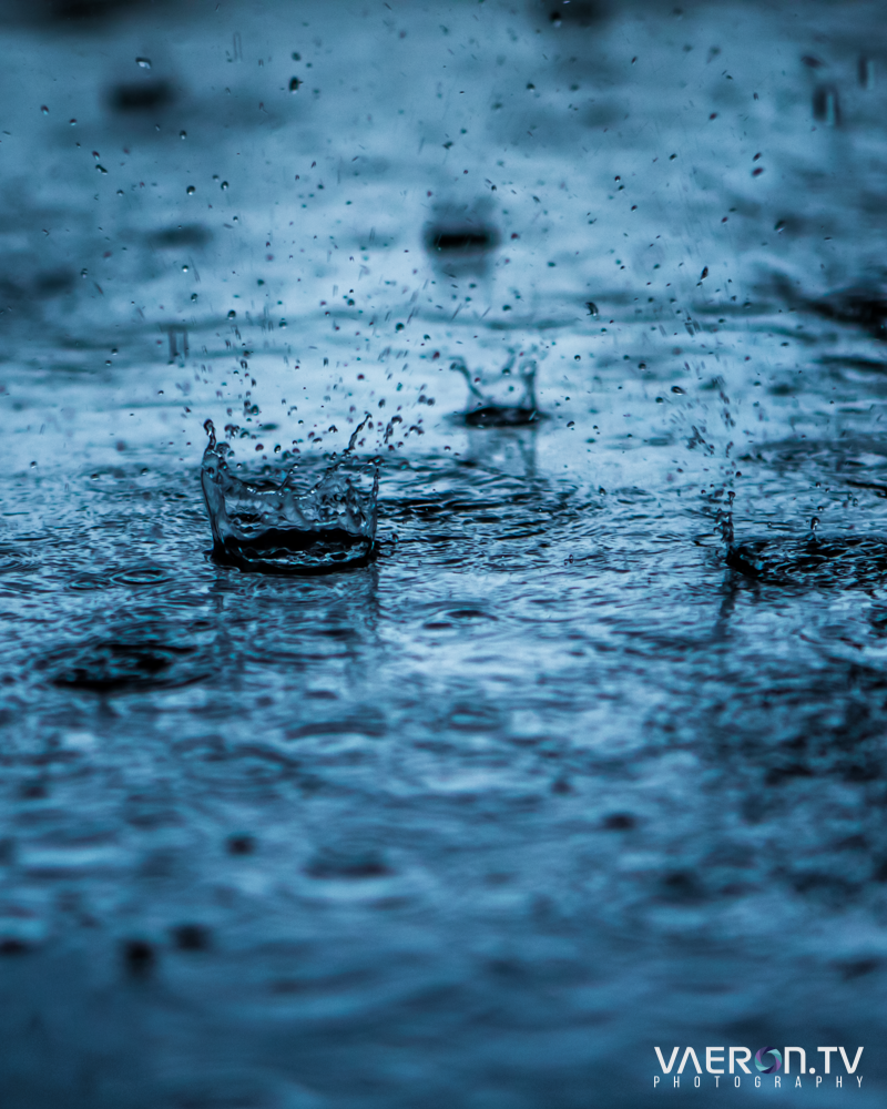 raindrops impacting water